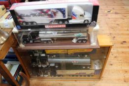 Boxed and cased large Diecast toy trucks with cargo carriages including Kenworth T2000, Amoco,