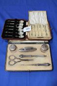 Cased set of six silver coffee spoons and set of cocktail sticks, and cased manicure set (3).