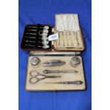 Cased set of six silver coffee spoons and set of cocktail sticks, and cased manicure set (3).