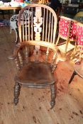 Windsor pierced splat back elbow chair.