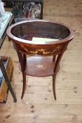 Late 19th Century oval inlaid mahogany jardiniere stand with undershelf on splayed legs,