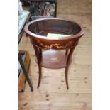 Late 19th Century oval inlaid mahogany jardiniere stand with undershelf on splayed legs,