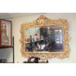Good ornate gilt framed rectangular bevelled wall mirror, 110cm by 123cm overall.