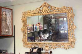 Good ornate gilt framed rectangular bevelled wall mirror, 110cm by 123cm overall.