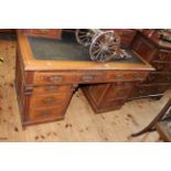 Victorian walnut desk having five drawers above a leather writing surface with two frieze drawers