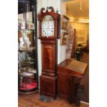 Antique mahogany eight day longcase clock having painted arched dial.