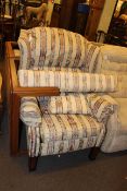 Reclining wing armchair in classical striped fabric and matching long stool.