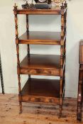 Siesta mahogany four tier etagé having two drawers and turned pillars, 128cm by 51cm.