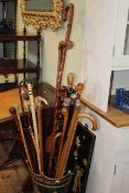 Collection of walking sticks including shark vertebrae, silver collared, wood knots, horn,