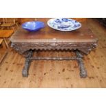 Victorian rectangular carved oak centre table having frieze drawer and raised on carved supports,