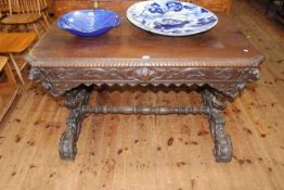 Victorian rectangular carved oak centre table having frieze drawer and raised on carved supports,