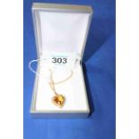 9 carat gold heart shaped pendant necklace with citrine and seed pearls.