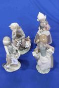 Collection of four Lladro girl figures.