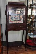 Edwardian mahogany display cabinet having glazed panel door above a drawer raised on cabriole legs