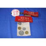 Vintage railway armbands and pay tokens.