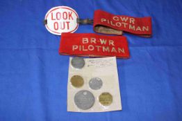 Vintage railway armbands and pay tokens.