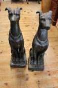 Pair of composite seated greyhounds, 79cm tall.