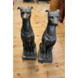 Pair of composite seated greyhounds, 79cm tall.