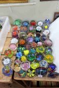 Collection of over forty five coloured glass paperweights.