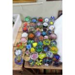 Collection of over forty five coloured glass paperweights.