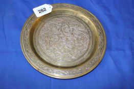 Islamic brass dish with silver inlay, 19.5cm diameter.