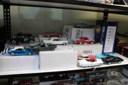Shelf collection of the Franklin and Danbury Mint Diecast toy cars including Simply Miles Ahead,