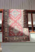 Oriental wool runner with a rose ground, 4.00 by 0.85.