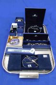 Collection of boxed Swarovski jewellery including necklace and bracelets, and pen and compact.