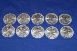 Ten 2014 Liberty United States 1oz silver dollar coins.