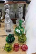 Victorian ruby and green glass crystal decanters with labels and two bottle tantalus.