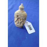 Chinese carved ivory scent bottle decorated with figures in strong relief, 8cm.