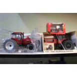 Four boxed tractor models and boxed toy models including ERTL, Britains, Magnum Farm Show Edition.