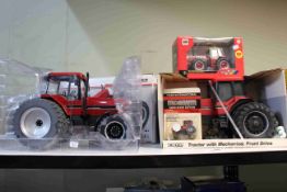 Four boxed tractor models and boxed toy models including ERTL, Britains, Magnum Farm Show Edition.