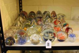 Domed and glass paperweights including mushrooms, flower spiral patterns.