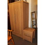 Contemporary oak effect double door wardrobe and two drawer pedestal chest.