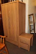 Contemporary oak effect double door wardrobe and two drawer pedestal chest.