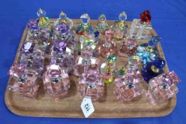Collection of twenty four glass scent bottles.