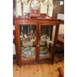 Late 19th/early 20th Century carved mahogany two door vitrine, 141cm by 102cm.