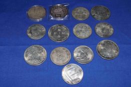Two troy (2oz) fine silver $10 Singapore 1999 coin and a collection of replica Oriental coins.