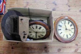 Three wooden wall clocks.