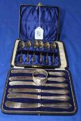 Cased set of six silver teaspoons, silver handled tea knives and napkin ring.