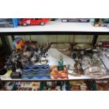 Shelf collection of silver plated wares, binoculars, cased glass ship, corkscrews, ceramics, etc.