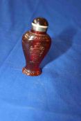 Amber baluster shape scent bottle decorated with figure and vase, 9cm.