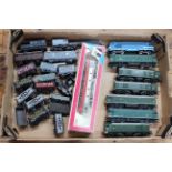 Collection of railway locomotives and train toy models.