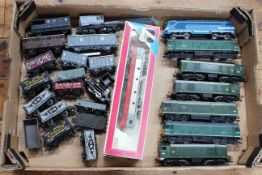 Collection of railway locomotives and train toy models.