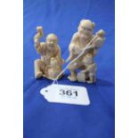 Two Japanese ivory Okimono, one Oni with child, signed 7cm, and one seated woodworker, 6cm.