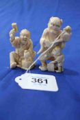 Two Japanese ivory Okimono, one Oni with child, signed 7cm, and one seated woodworker, 6cm.