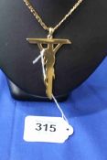 Gold 'Jesus on the Cross' pendant with 9 carat gold necklace.