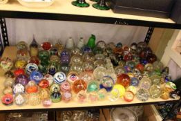 Large collection of coloured and domed paperweights.