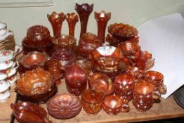 Large collection of orange Carnival glass including vases, bowls, jugs, cups, etc.